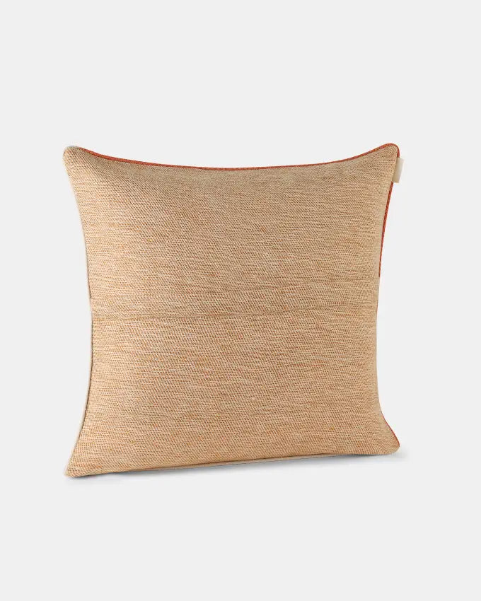 Apricot-toned Alchi square cushion cover with contrasting terracotta and white piping