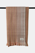 Apricot-toned Alchi wool throw with natural woven texture