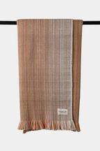 Apricot-toned Alchi wool throw with natural woven texture