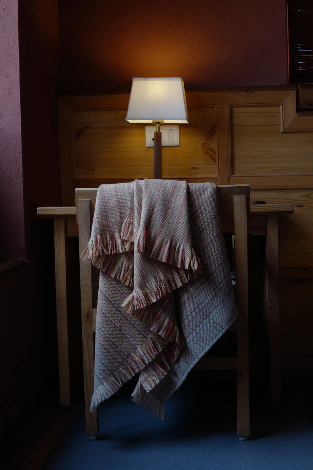 Alchi Apricot Wool Throw with warm earthy hues and fringed edges