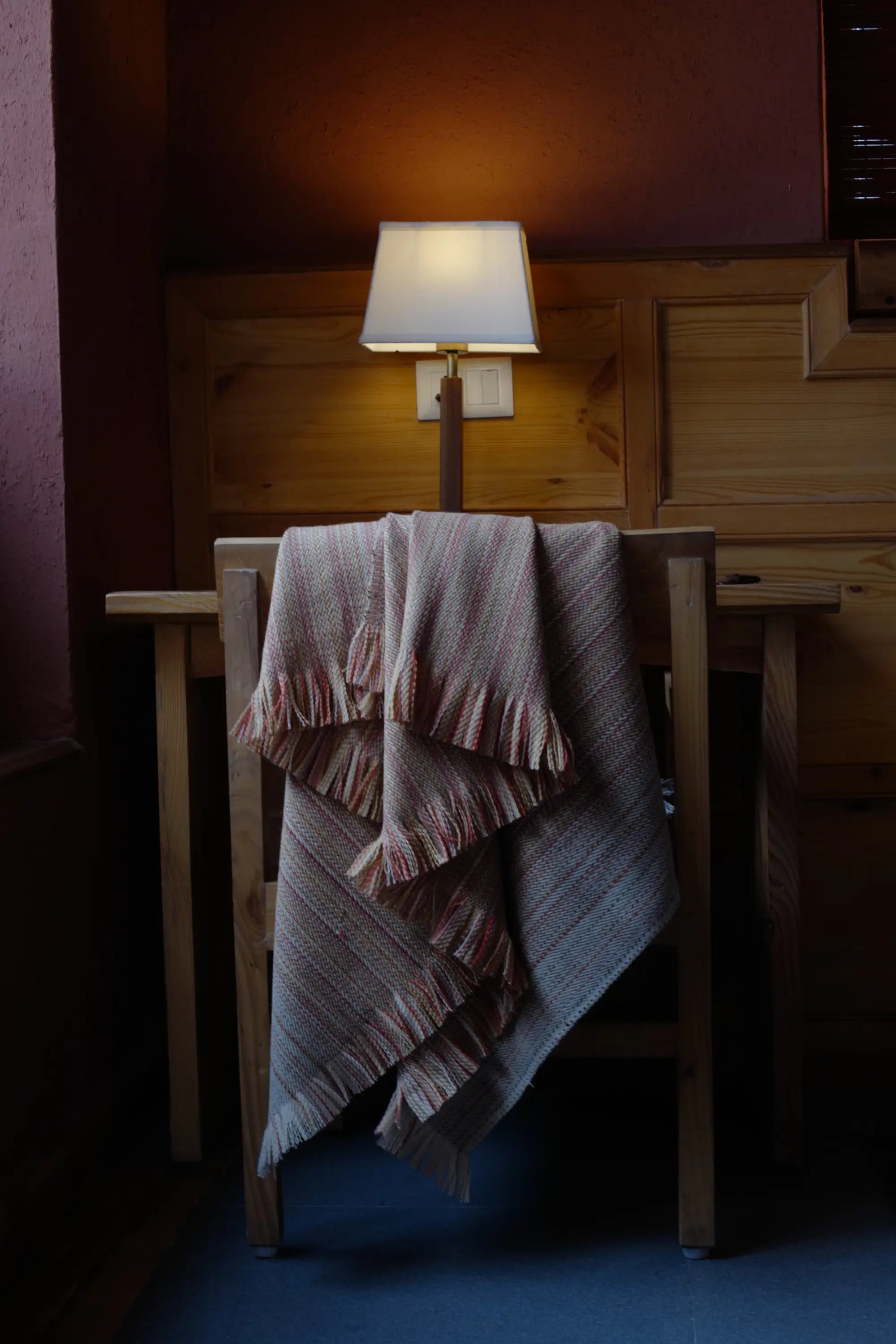 Alchi Apricot Wool Throw with warm earthy hues and fringed edges
