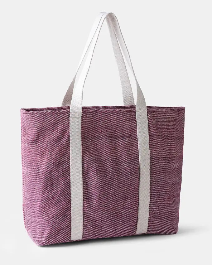 Aliza Travel Bag showcasing natural undyed and madder root–dyed wool weave