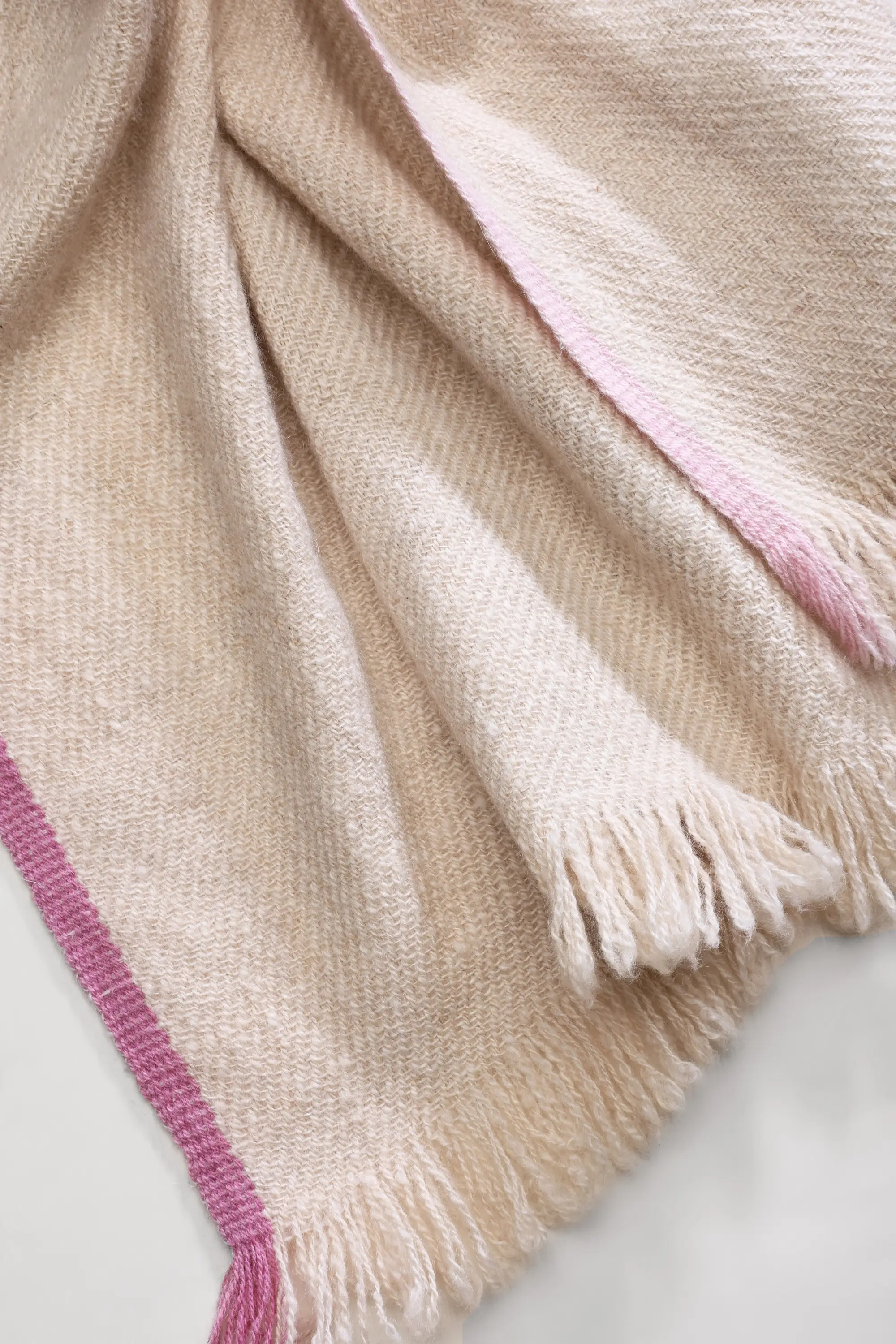 Handwoven Chuma Pashmina Shawl in cream, white, and beige with pink border