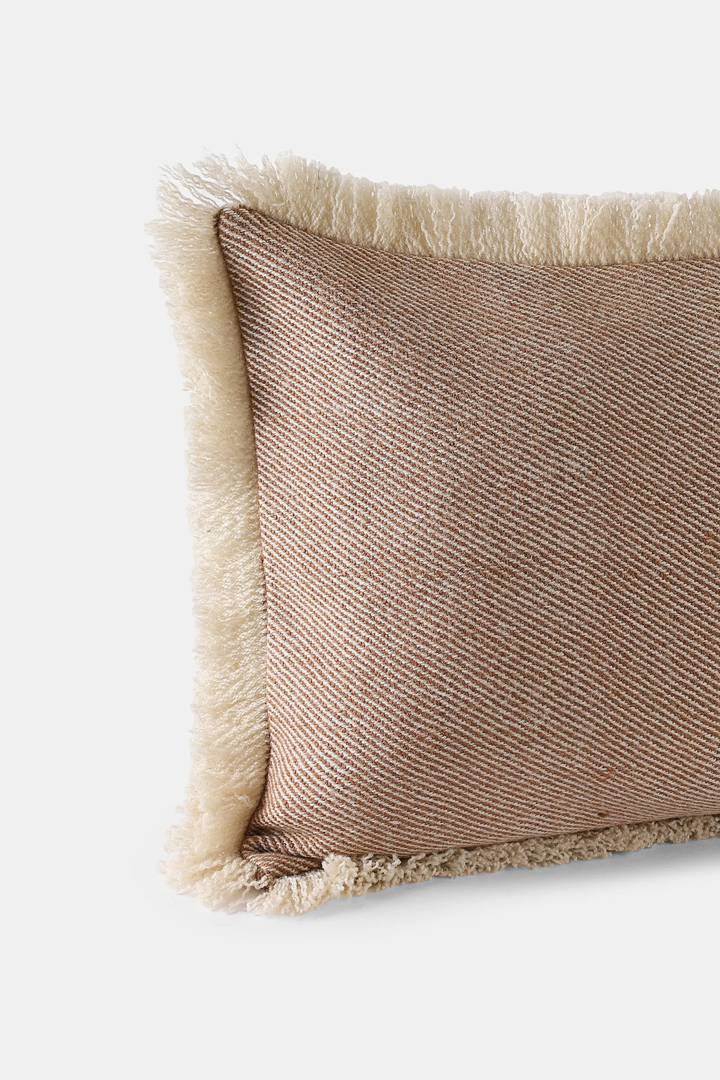 Rectangular Khardung Mist cushion with walnut-dyed yarn and fringed edges