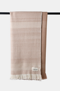 Khardung Mist Wool Throw with walnut husk dyed stripes and fringed edges