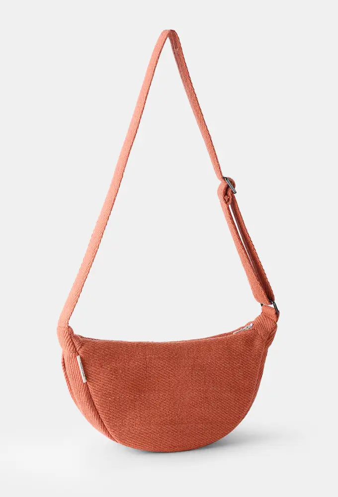 Manjis Crossbody Bag with adjustable shoulder strap and zipper closure