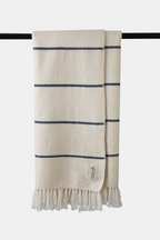 Ivory Shey Sunset wool throw with blue stripe accents