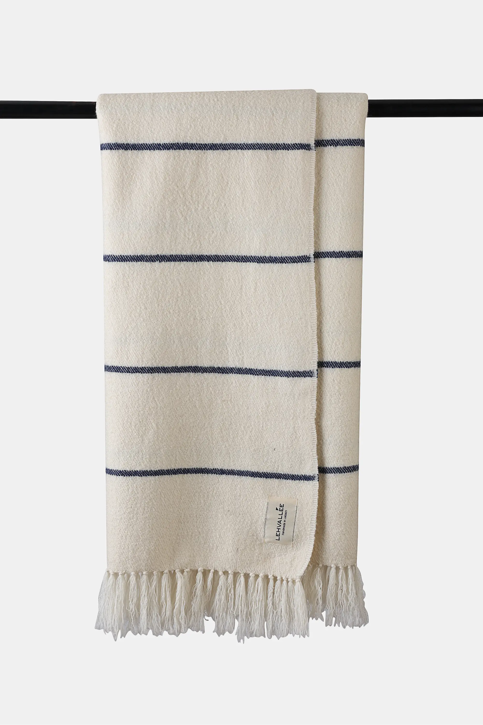 Ivory Shey Sunset wool throw with blue stripe accents